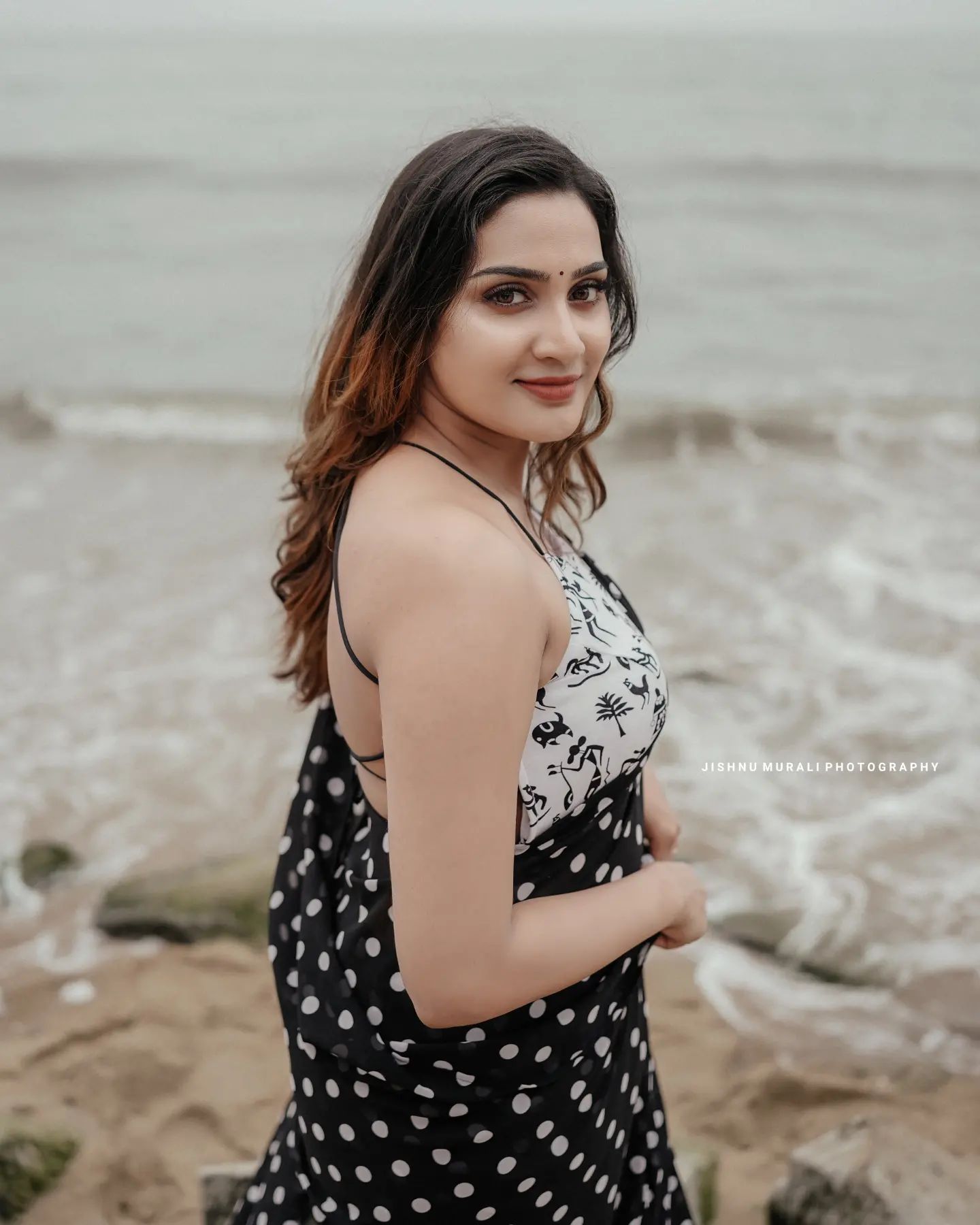 aditi-ravi-in-black-dot-print-saree-006.jpeg