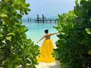 ahaana-krishna-yellow-sleeveless-gown-photoshoot-at-maldives-003