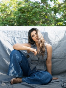 aishwarya-rajesh-in-Tailored-sleeveless-vest-top-paired-casually-with-wide-leg-blue-denim-jeans-002