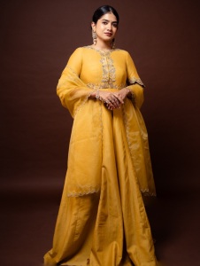 anarkali-marikar-in-A-bright-mustard-yellow-silk-or-chanderi-tunic-dress-featuring-a-round-neckline-half-length-sleeves-and-a-flares-out-into-a-flowing-skirt-003