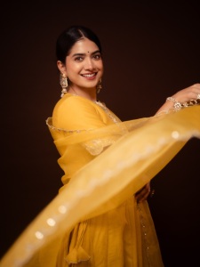 anarkali-marikar-in-A-bright-mustard-yellow-silk-or-chanderi-tunic-dress-featuring-a-round-neckline-half-length-sleeves-and-a-tailored-bodice-that-flares-out-into-a-flowing-skirt