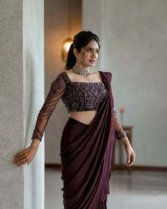 anarkali-marikar-in-modern-pre-draped-saree-in-a-deep-wine-or-plum-hue-made-of-fluid-glossy-fabric-005