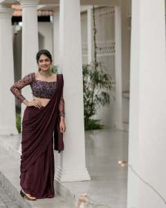 anarkali-marikar-in-modern-pre-draped-saree-in-a-deep-wine-or-plum-hue-made-of-fluid-glossy-fabric-006