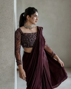 anarkali-marikar-in-modern-pre-draped-saree-in-a-deep-wine-or-plum-hue-made-of-fluid-glossy-fabric-009