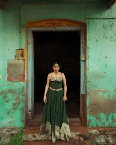 anarkali-marikar-in-structured-olive-green-corset-top-with-thin-straps-and-cupped-satin-detailing-at-the-bust-paired-with-dark-green-flared-skirt-004