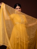 anarkali-marikar-in-A-bright-mustard-yellow-silk-or-chanderi-tunic-dress-featuring-a-round-neckline-half-length-sleeves-and-a-flares-out-into-a-flowing-skirt-001