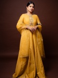 anarkali-marikar-in-A-bright-mustard-yellow-silk-or-chanderi-tunic-dress-featuring-a-round-neckline-half-length-sleeves-and-a-flares-out-into-a-flowing-skirt-003