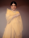 anarkali-marikar-in-A-bright-mustard-yellow-silk-or-chanderi-tunic-dress-featuring-a-round-neckline-half-length-sleeves-and-a-flares-out-into-a-flowing-skirt-004