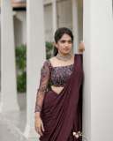 anarkali-marikar-in-modern-pre-draped-saree-in-a-deep-wine-or-plum-hue-made-of-fluid-glossy-fabric-003