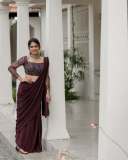 anarkali-marikar-in-modern-pre-draped-saree-in-a-deep-wine-or-plum-hue-made-of-fluid-glossy-fabric-006