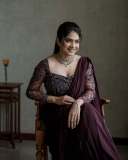 anarkali-marikar-in-modern-pre-draped-saree-in-a-deep-wine-or-plum-hue-made-of-fluid-glossy-fabric-007