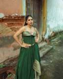 anarkali-marikar-in-structured-olive-green-corset-top-with-thin-straps-and-cupped-satin-detailing-at-the-bust-paired-with-dark-green-flared-skirt-002