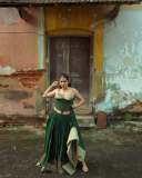 anarkali-marikar-in-structured-olive-green-corset-top-with-thin-straps-and-cupped-satin-detailing-at-the-bust-paired-with-dark-green-flared-skirt-007