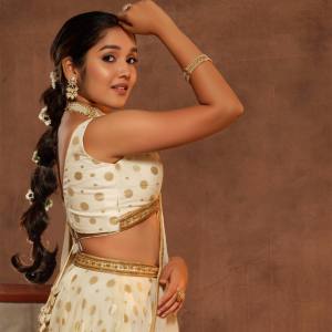 anikha-surendran-in-white-lehenga-photos-004