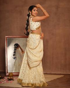anikha-surendran-in-white-lehenga-photos-015
