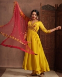 anikha-surendran-in-yellow-churidar-with-red-shawl-photos-003