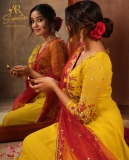 anikha-surendran-in-yellow-churidar-with-red-shawl-photos-004