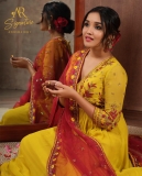 anikha-surendran-in-yellow-churidar-with-red-shawl-photos
