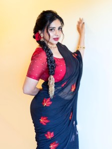 anna-rajan-in-sheer-dark-navy-blue-saree-with-contrasting-bright-crimson-red-short-sleeved-blouse-photos-001