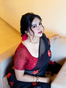 anna-rajan-in-sheer-dark-navy-blue-saree-with-contrasting-bright-crimson-red-short-sleeved-blouse-photos-002
