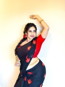 anna-rajan-in-sheer-dark-navy-blue-saree-with-contrasting-bright-crimson-red-short-sleeved-blouse-photos-003