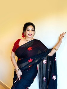 anna-rajan-in-sheer-dark-navy-blue-saree-with-contrasting-bright-crimson-red-short-sleeved-blouse-photos-005