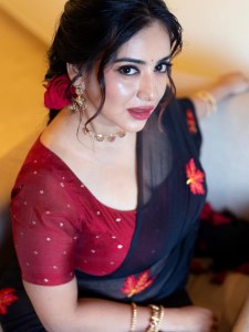 anna-rajan-in-sheer-dark-navy-blue-saree-with-contrasting-bright-crimson-red-short-sleeved-blouse-photos