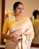 anumol-in-golden-saree-with-yellow-blouse-photos-005