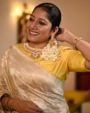 anumol-in-golden-saree-with-yellow-blouse-photos-006