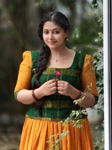 anu-sithara-in-green-and-yellow-dhavani-combination-photos-001