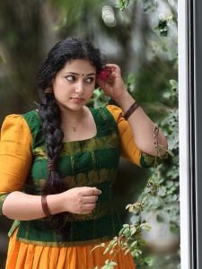 anu-sithara-in-green-and-yellow-dhavani-combination-photos-002