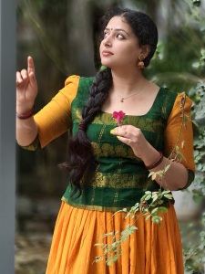 anu-sithara-in-green-and-yellow-dhavani-combination-photos-003