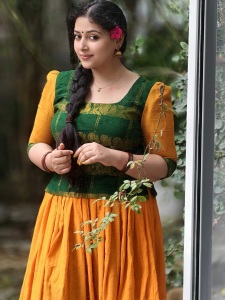anu-sithara-in-green-and-yellow-dhavani-combination-photos-005