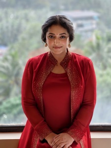 anu-sithara-in-wine-red-overcoat-with-long-dress-photo-001