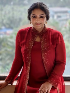 anu-sithara-in-wine-red-overcoat-with-long-dress-photo