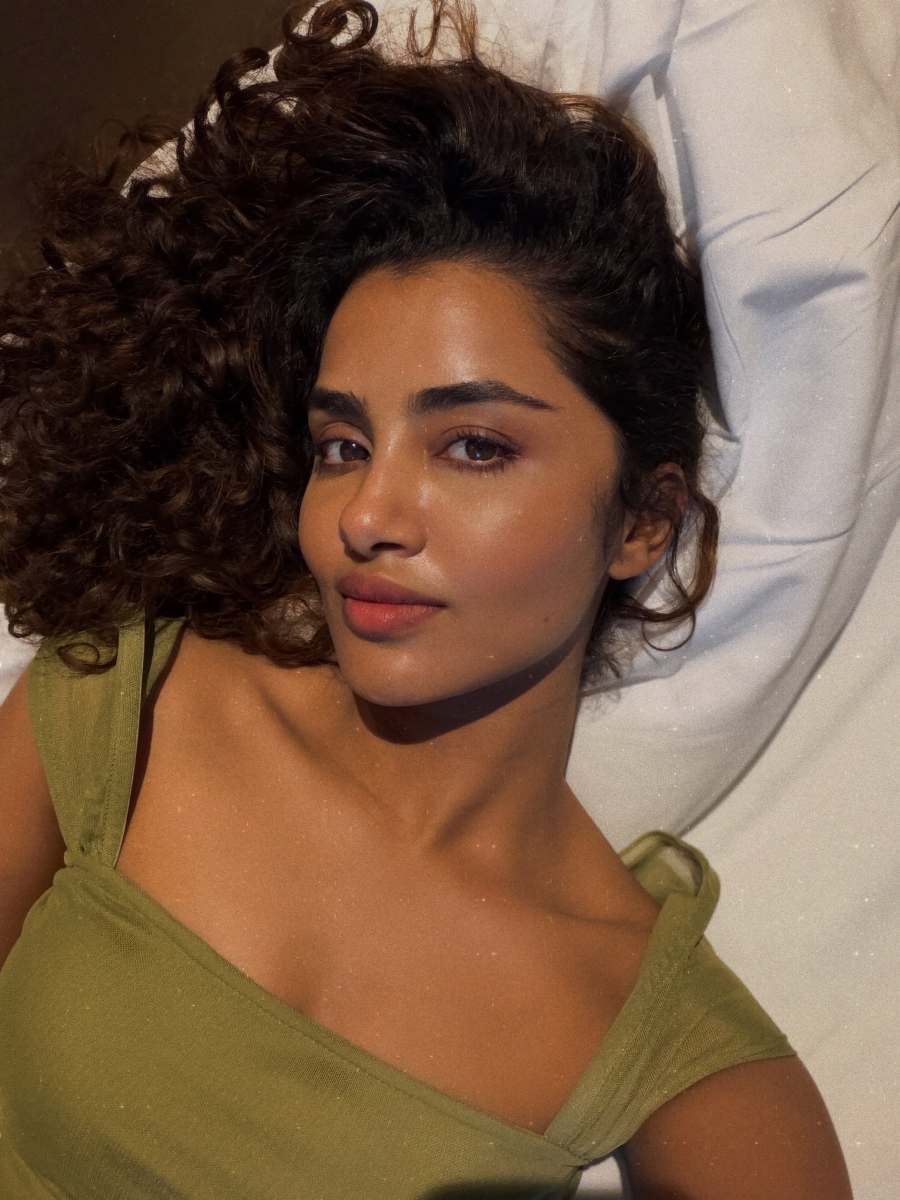 anupama-parameswaran-in-Olive-green-sleeveless-fitted-crop-top-with-Light-wash-denim-jeans-Features-standard-belt-loops-silver-button-or-rivet-hardware-style-photos-009