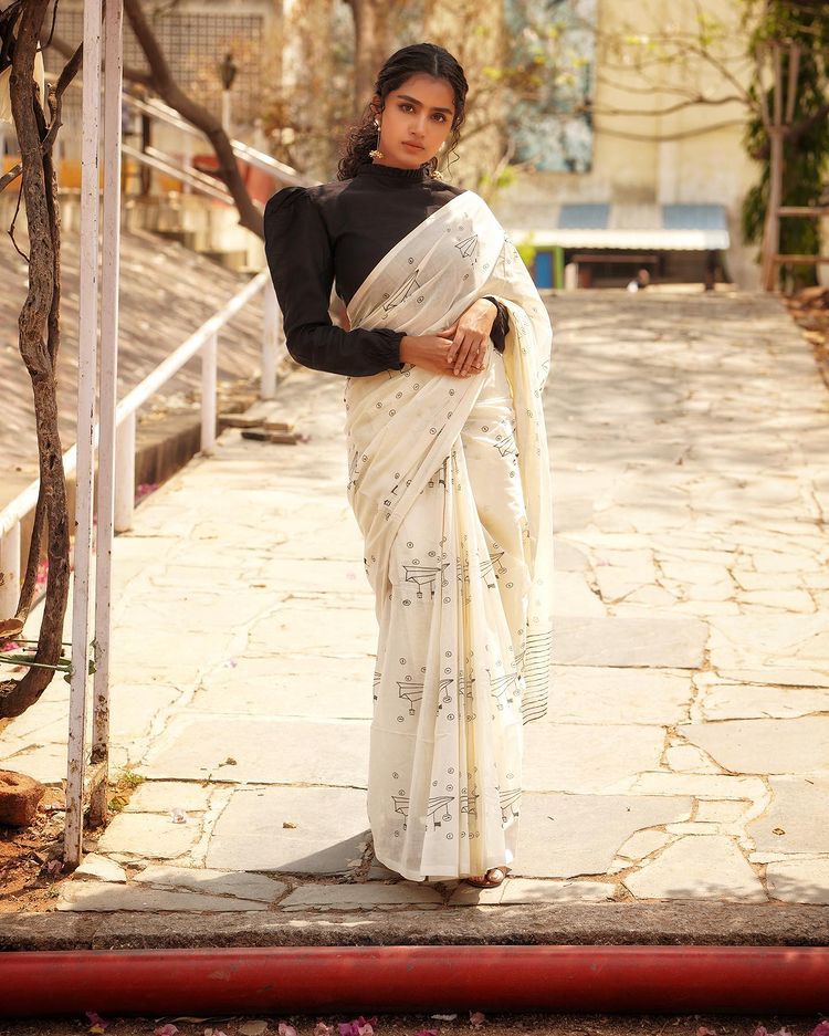 anupama-parameswaran-in-white-saree-with-black-full-sleeve-blouse-002