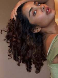 anupama-parameswaran-in-Olive-green-sleeveless-fitted-crop-top-with-Light-wash-denim-jeans-Features-standard-belt-loops-silver-button-or-rivet-hardware-style-photos-004