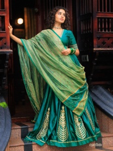 anupama-parameswaran-in-teal-blue-green-long-fitted-top-blouse-V-neckline-and-elbow-length-sleeves-with-patterned-cuffs-Lehenga-Set-photos-005