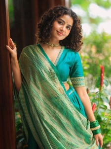 anupama-parameswaran-in-teal-blue-green-long-fitted-top-blouse-V-neckline-and-elbow-length-sleeves-with-patterned-cuffs-Lehenga-Set-photos-009