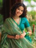 anupama-parameswaran-in-teal-blue-green-long-fitted-top-blouse-V-neckline-and-elbow-length-sleeves-with-patterned-cuffs-Lehenga-Set-photos-006