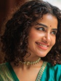 anupama-parameswaran-in-teal-blue-green-long-fitted-top-blouse-V-neckline-and-elbow-length-sleeves-with-patterned-cuffs-Lehenga-Set-photos-007