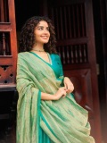 anupama-parameswaran-in-teal-blue-green-long-fitted-top-blouse-V-neckline-and-elbow-length-sleeves-with-patterned-cuffs-Lehenga-Set-photos-010
