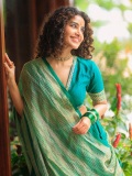 anupama-parameswaran-in-teal-blue-green-long-fitted-top-blouse-V-neckline-and-elbow-length-sleeves-with-patterned-cuffs-Lehenga-Set-photos