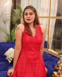 anusree-in-red-sleeveless-dress-photos-004