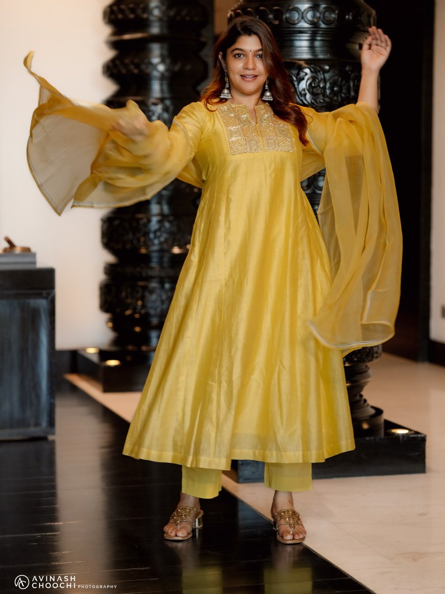 aparna-balamurali-in-sun-yellow-silk-blend-Anarkali-suit-set-photos-001