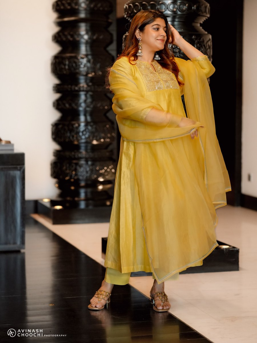 aparna-balamurali-in-sun-yellow-silk-blend-Anarkali-suit-set-photos-004