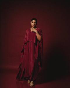 aparna-balamurali-in-deep-maroon-cape-style-gown-design-photos-002