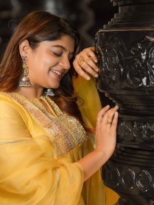 aparna-balamurali-in-sun-yellow-silk-blend-Anarkali-suit-set-photos-003