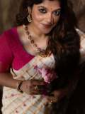 aparna-balamurali-in-ivory-organza-saree-contrasting-magenta-pink-silk-blouse-and-Soft-smoky-eye-warm-muted-nude-pink-lip-color-pics